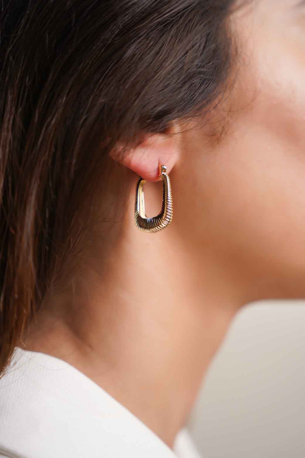 GOLD U COILED EARRING