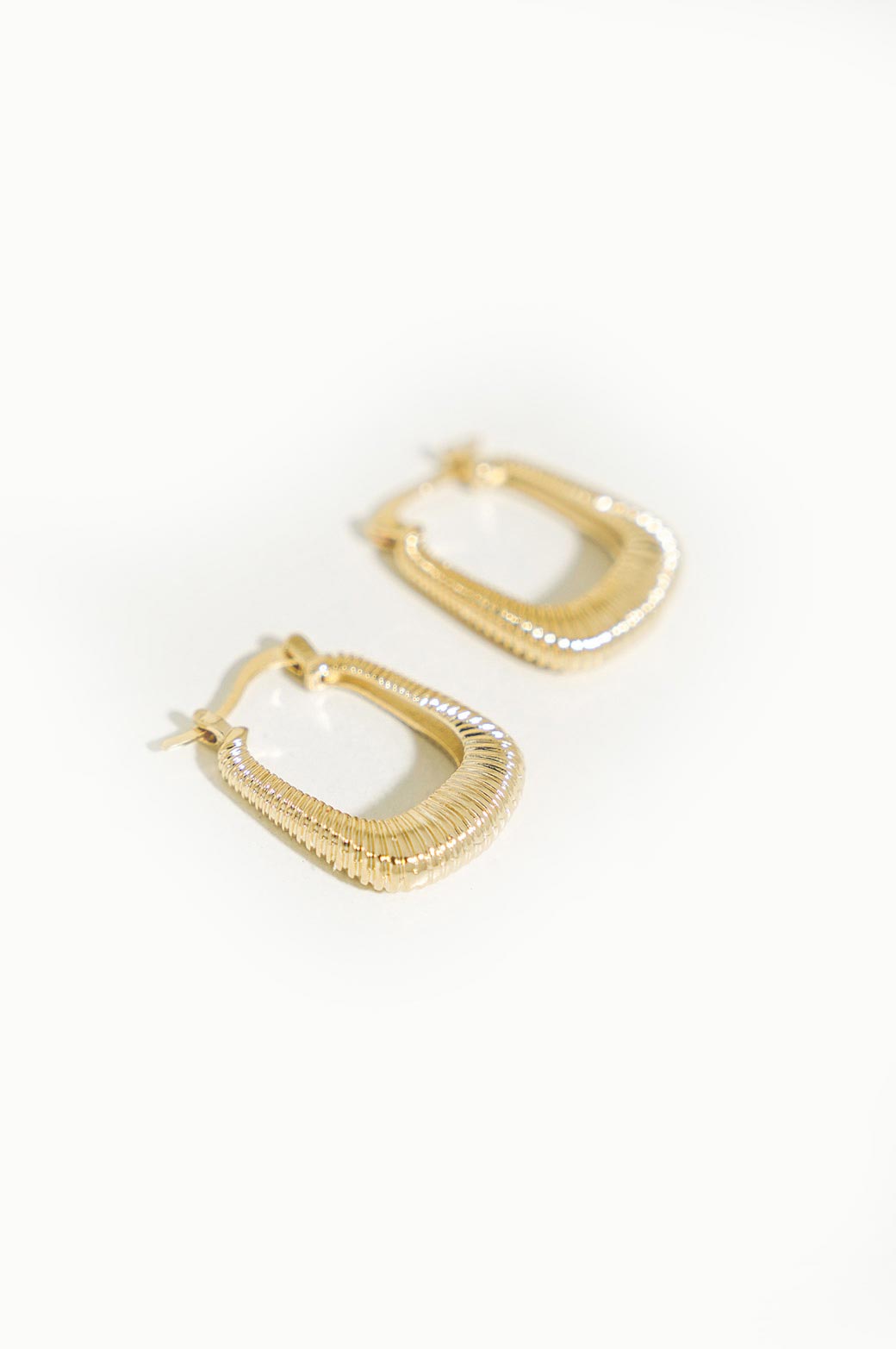 GOLD U COILED EARRING