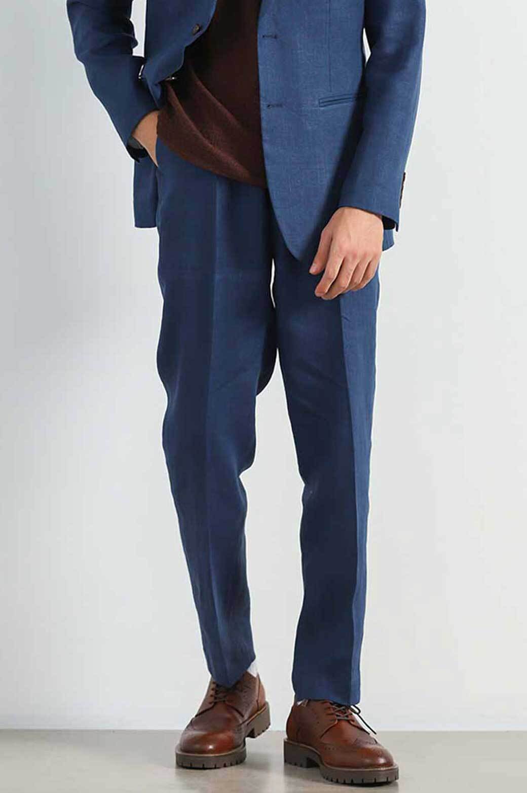navy blue blazer and grey pants