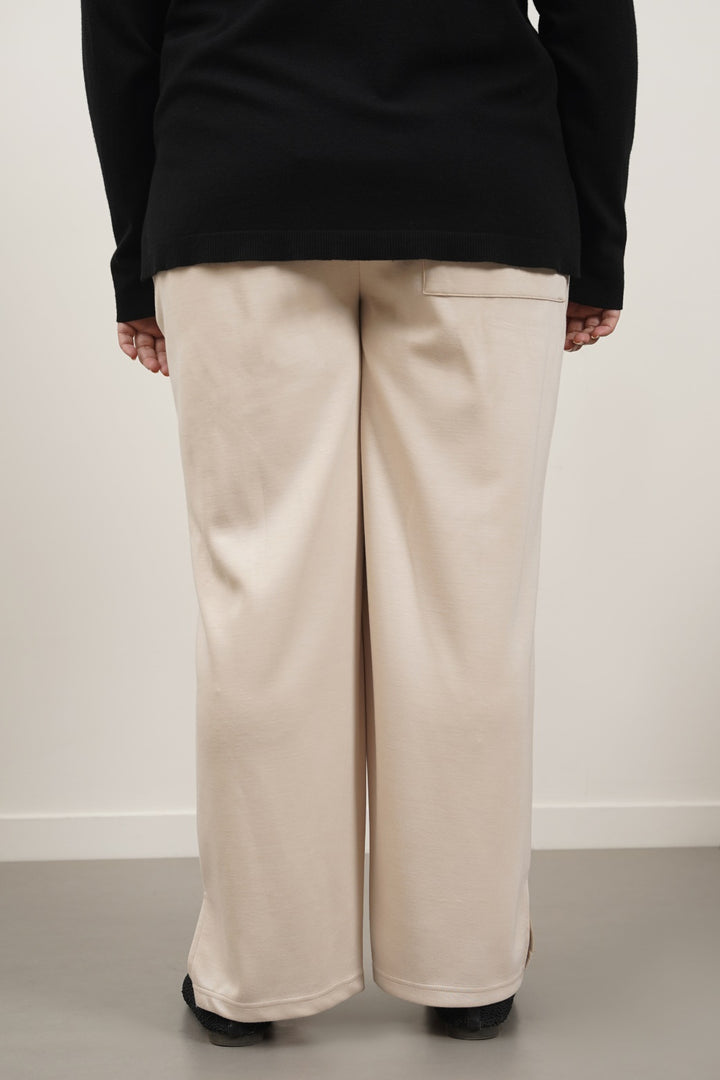 BEIGE CURVE PLEATED NEOPRENE TROUSERS