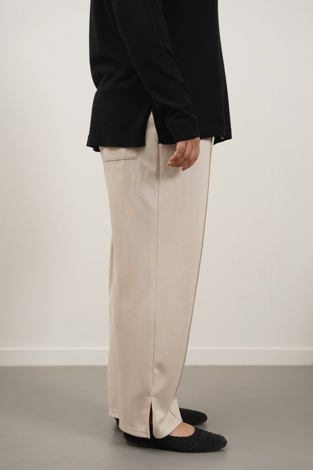 BEIGE CURVE PLEATED NEOPRENE TROUSERS