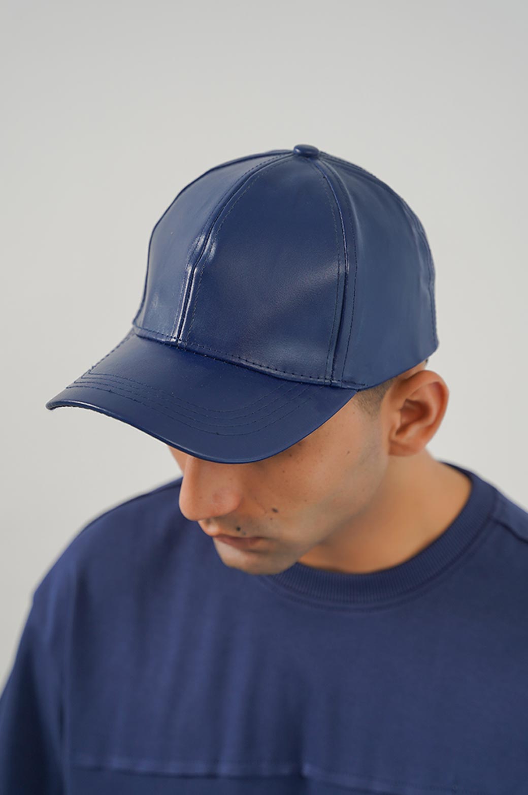 NAVY FAUX LEATHER CAP 