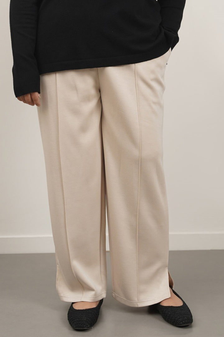 BEIGE CURVE PLEATED NEOPRENE TROUSERS